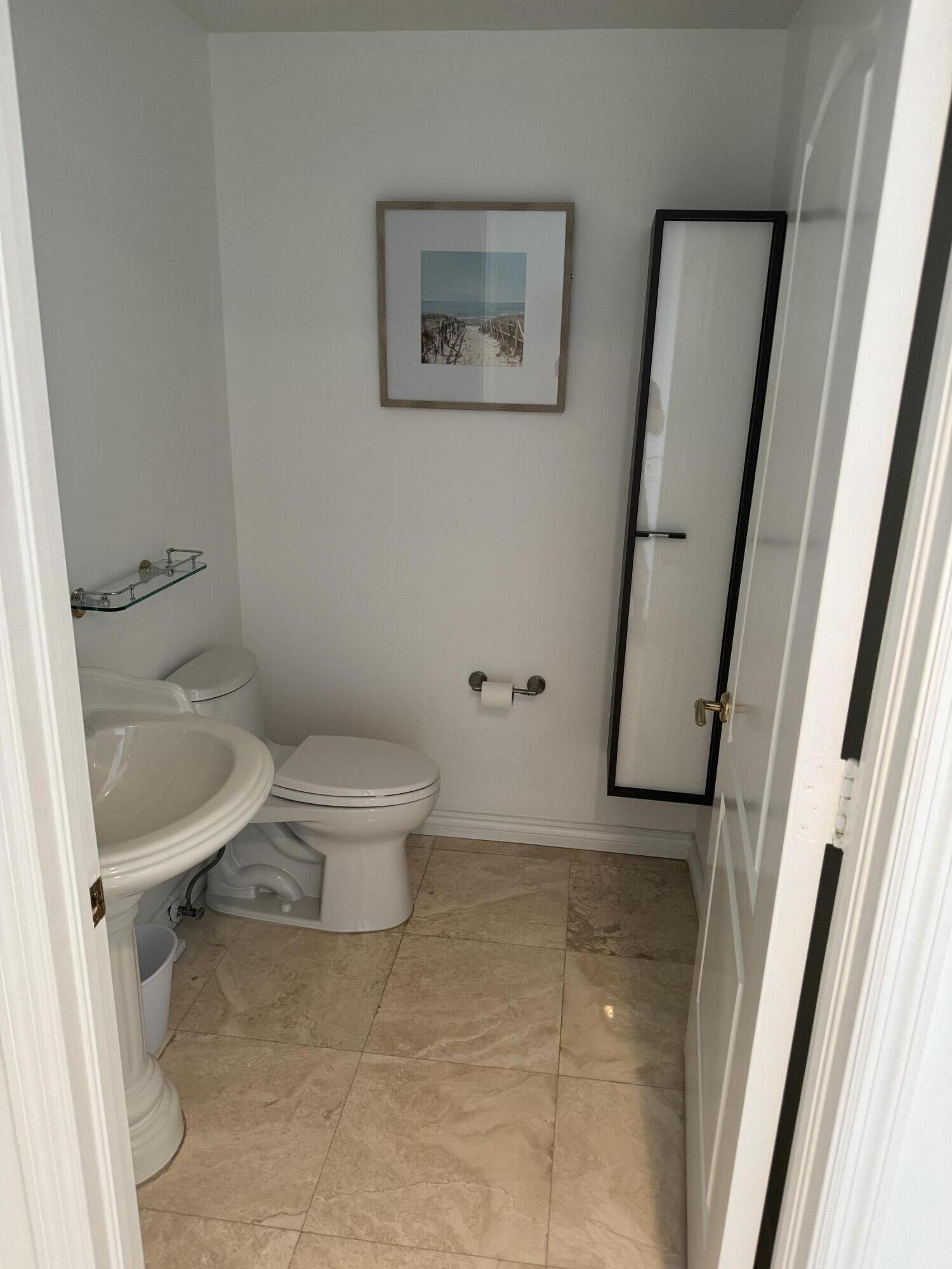 550 Southeast Mizner Boulevard, Unit B702 Boca Raton, FL 33432 - Photo 9 of 11 a bathroom with a toilet and a shower