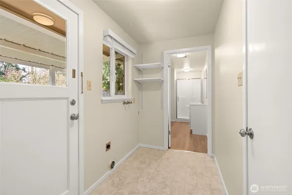 a view of a bathroom with a shower and a sink