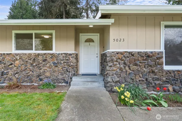 a front view of a house with garden
