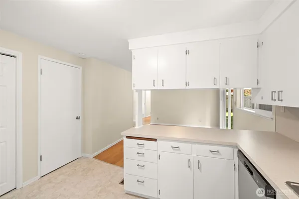 a view of a kitchen with cabinets