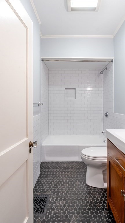 155 Marked Tree Road Needham, MA 02492 - Photo 23 of 34 a bathroom with a toilet a sink and a bathtub