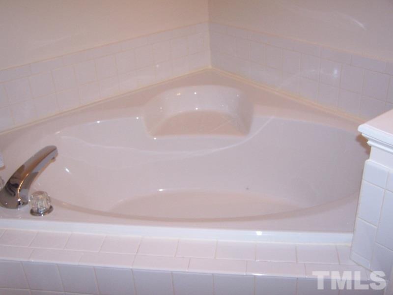 3811 Axle Lane Raleigh, NC 27616 - Photo 14 of 24 a bathroom with a bathtub