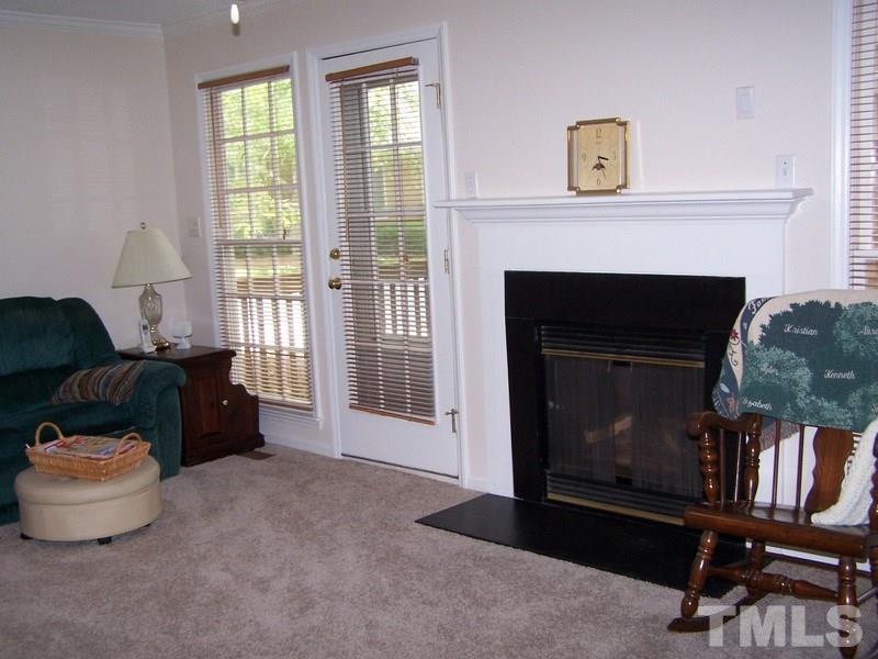 3811 Axle Lane Raleigh, NC 27616 - Photo 8 of 24 a living room with furniture and a fireplace