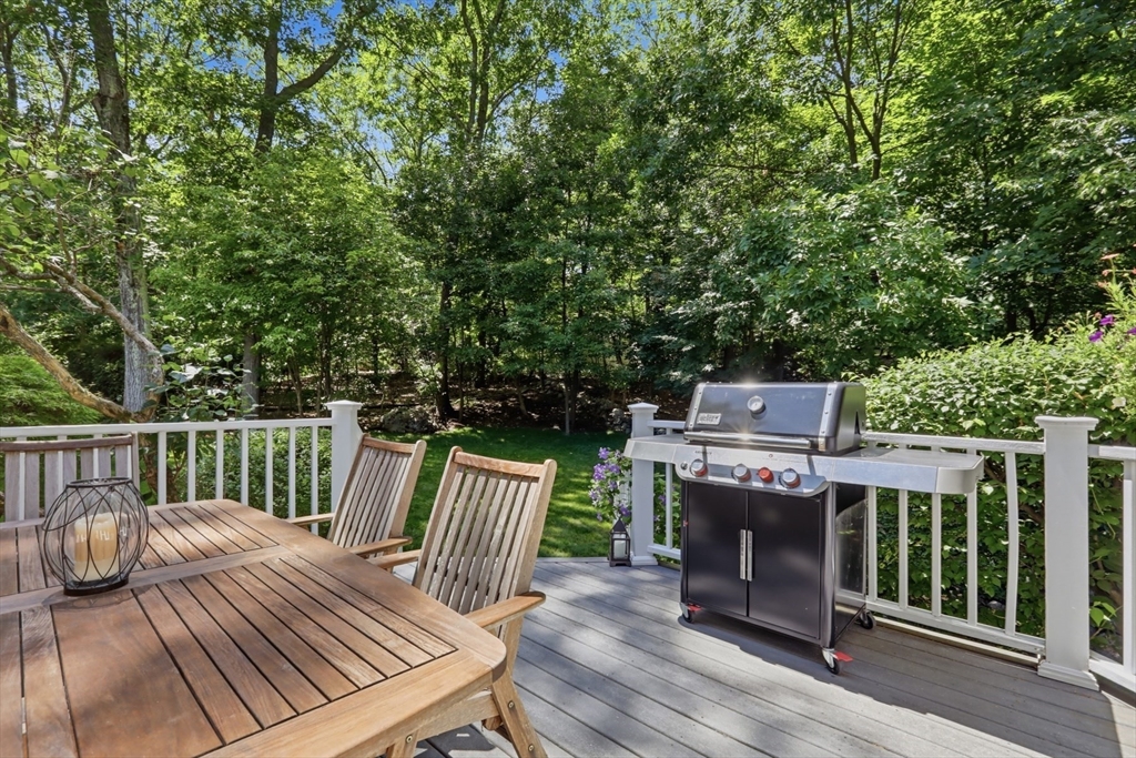2 Olde Lyme Road Winchester, MA 01890 - Photo 35 of 42 a view of a deck with furniture and trees