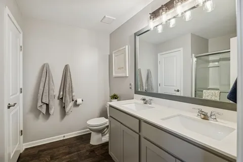 a living room with furniture and a night stand