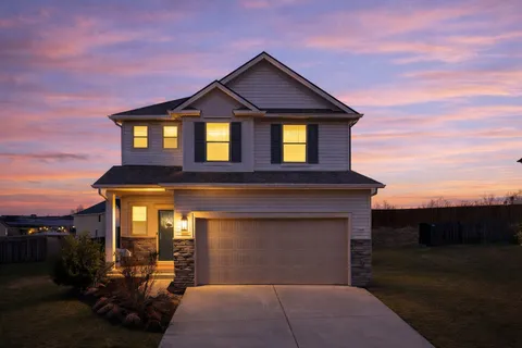 a front view of a house with a yard