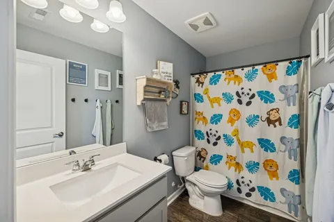 a room with wooden floor and chair