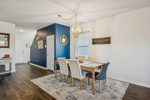 a view of a table and chairs in a room