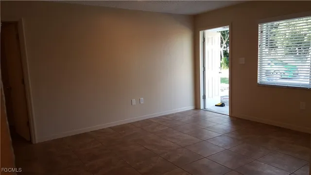 a view of an empty room and window