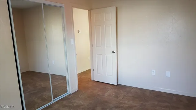 an empty room with wooden door