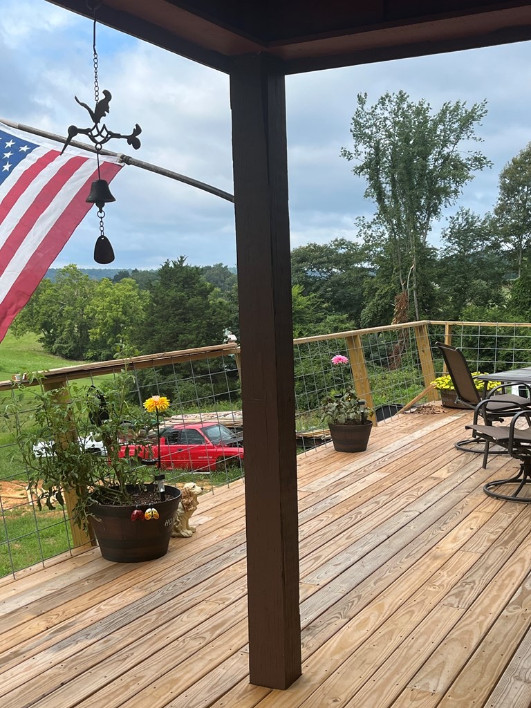 2711 Sullivan Knowles Road Sparta, TN 38583 - Photo 13 of 42 a view of a balcony with wooden floor and outdoor space
