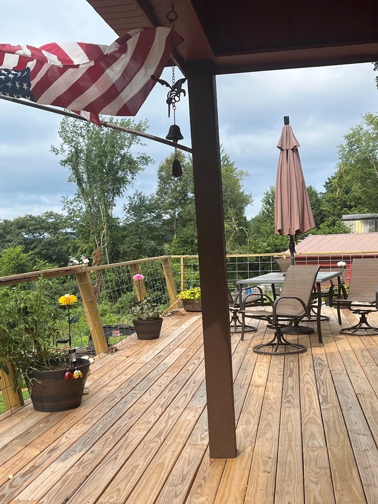 2711 Sullivan Knowles Road Sparta, TN 38583 - Photo 15 of 42 a view of balcony with wooden floor and outdoor seating