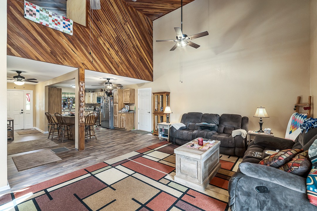 2711 Sullivan Knowles Road Sparta, TN 38583 - Photo 23 of 42 a living room with lots of furniture and a chandelier