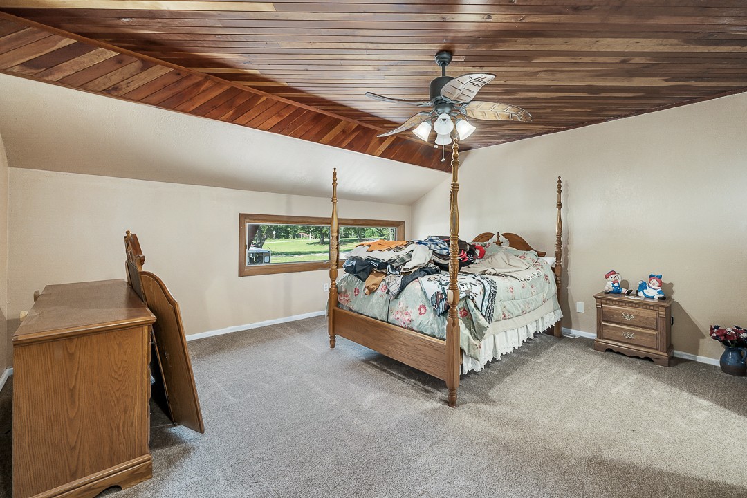 2711 Sullivan Knowles Road Sparta, TN 38583 - Photo 31 of 42 a bed room with a bed and a ceiling fan