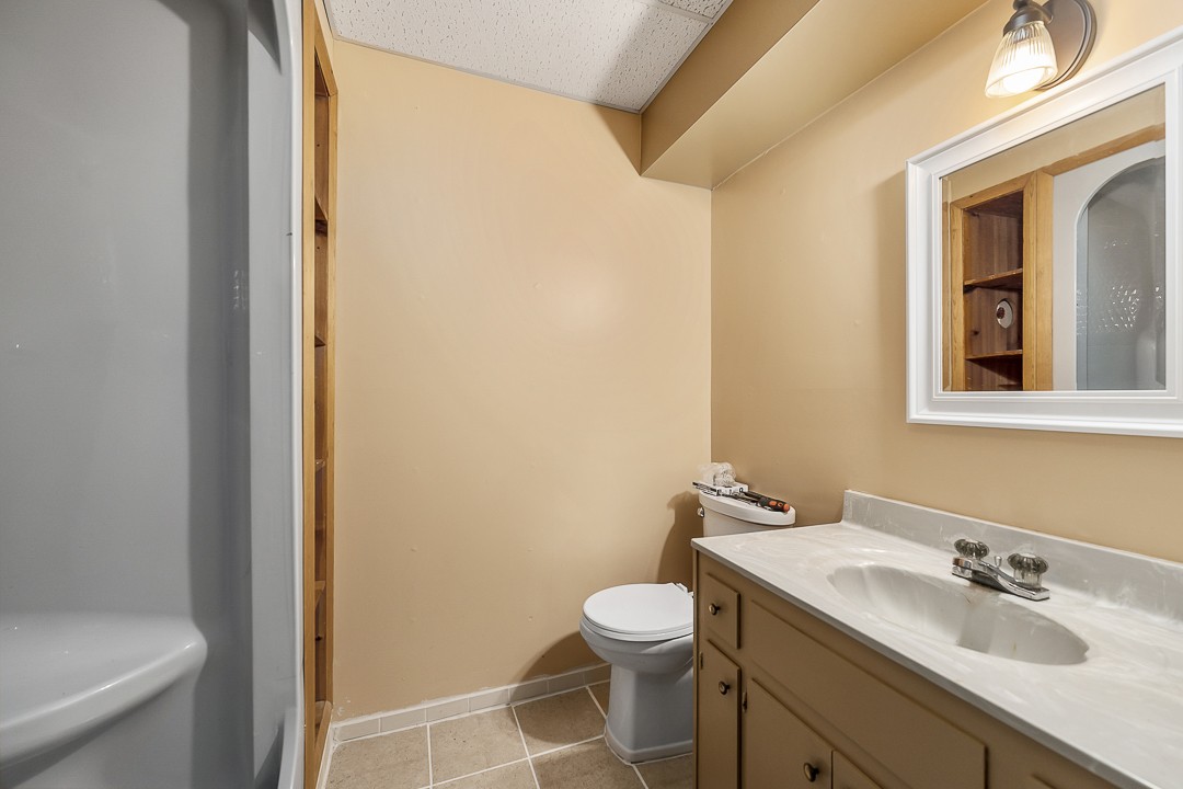 2711 Sullivan Knowles Road Sparta, TN 38583 - Photo 37 of 42 a bathroom with a sink and a mirror