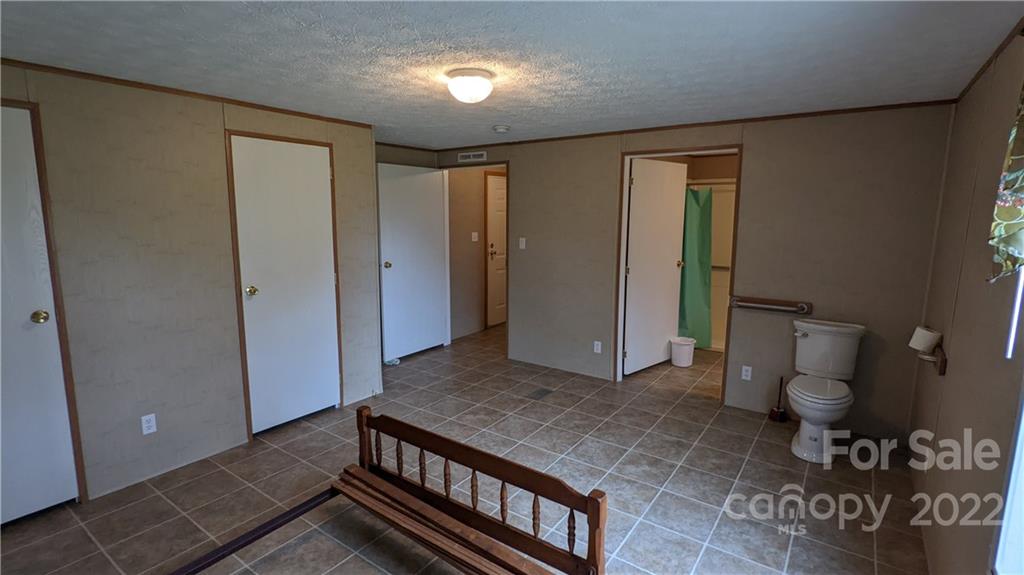 1351 Liberty Road Chester, SC 29706 - Photo 11 of 28 a spacious bathroom with a toilet and a shower