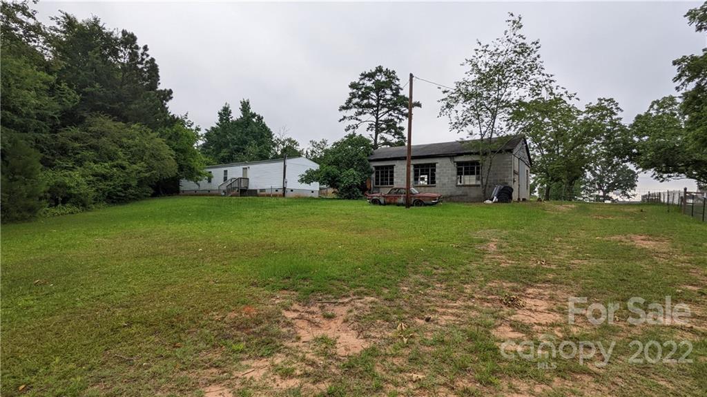 1351 Liberty Road Chester, SC 29706 - Photo 23 of 28 a view of a house with a big yard and large trees