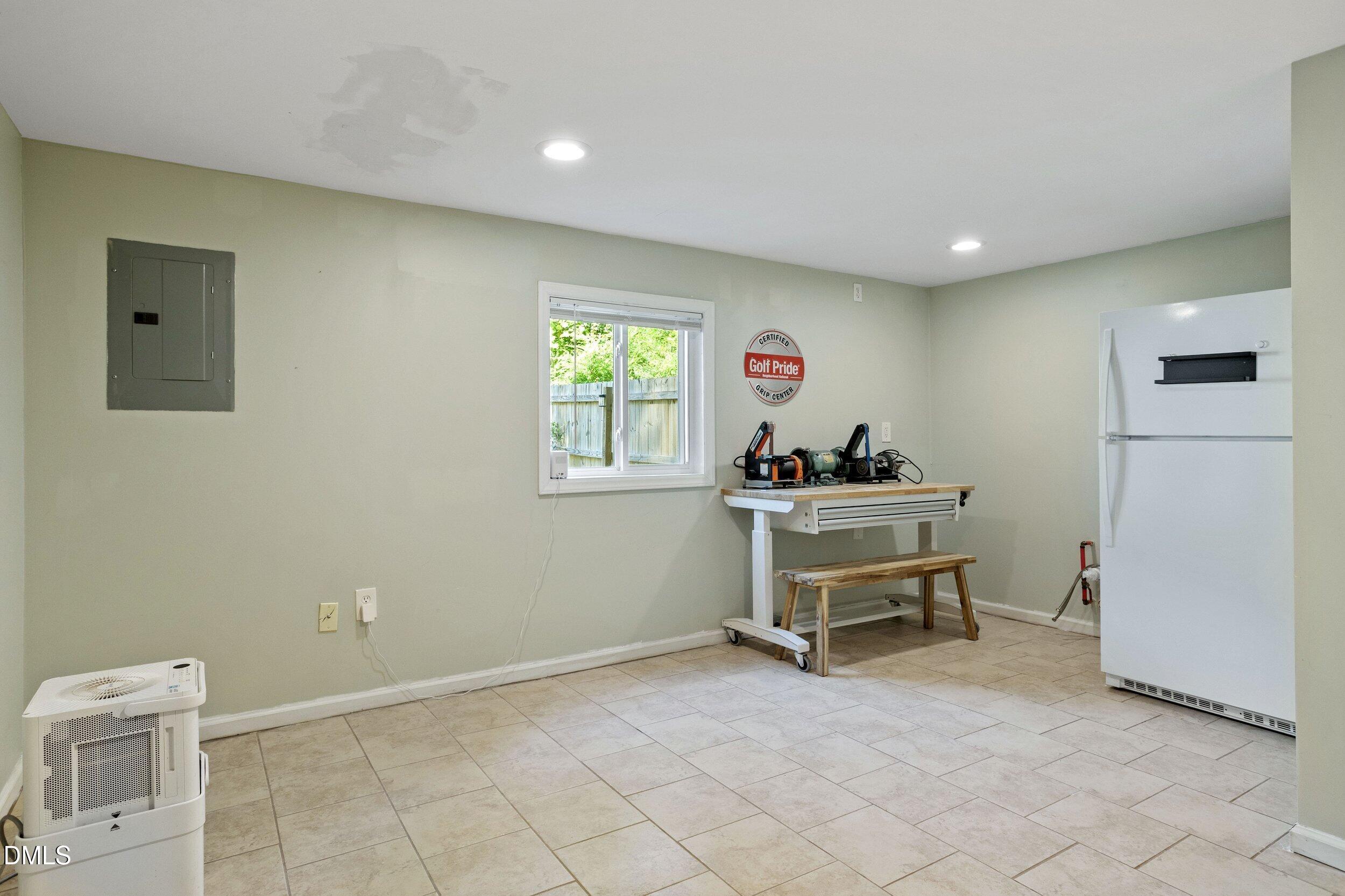 4409 Randall Road Durham, NC 27707 - Photo 28 of 33 Lower level ADU, Includes full-size refrigerator, and plumbing/electrical for a kitchen