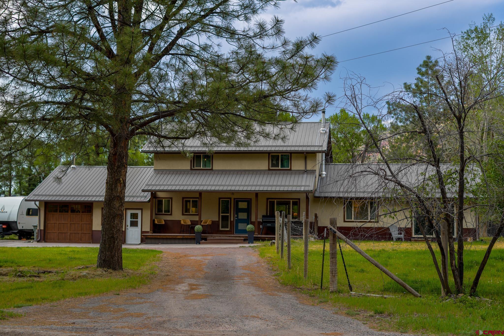 559 Suzanne Lane Ridgway, CO 81432 - Photo 1 of 45 a view of a house with a swimming pool