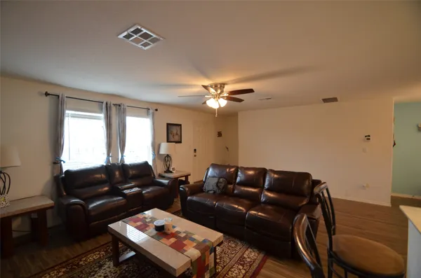a living room with furniture and a window