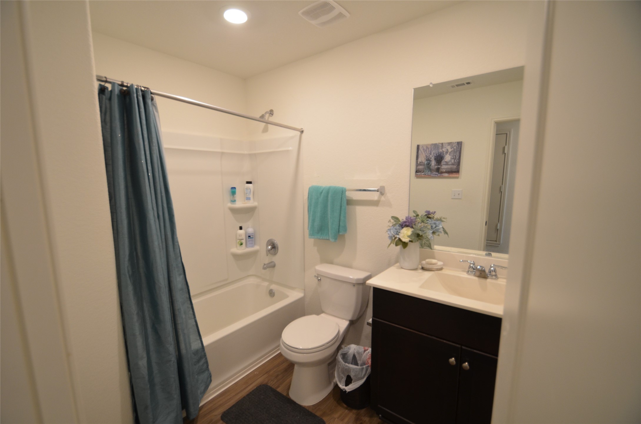 13706 Mussel Run Elgin, TX 78621 - Photo 19 of 34 a bathroom with a sink a toilet and shower a mirror