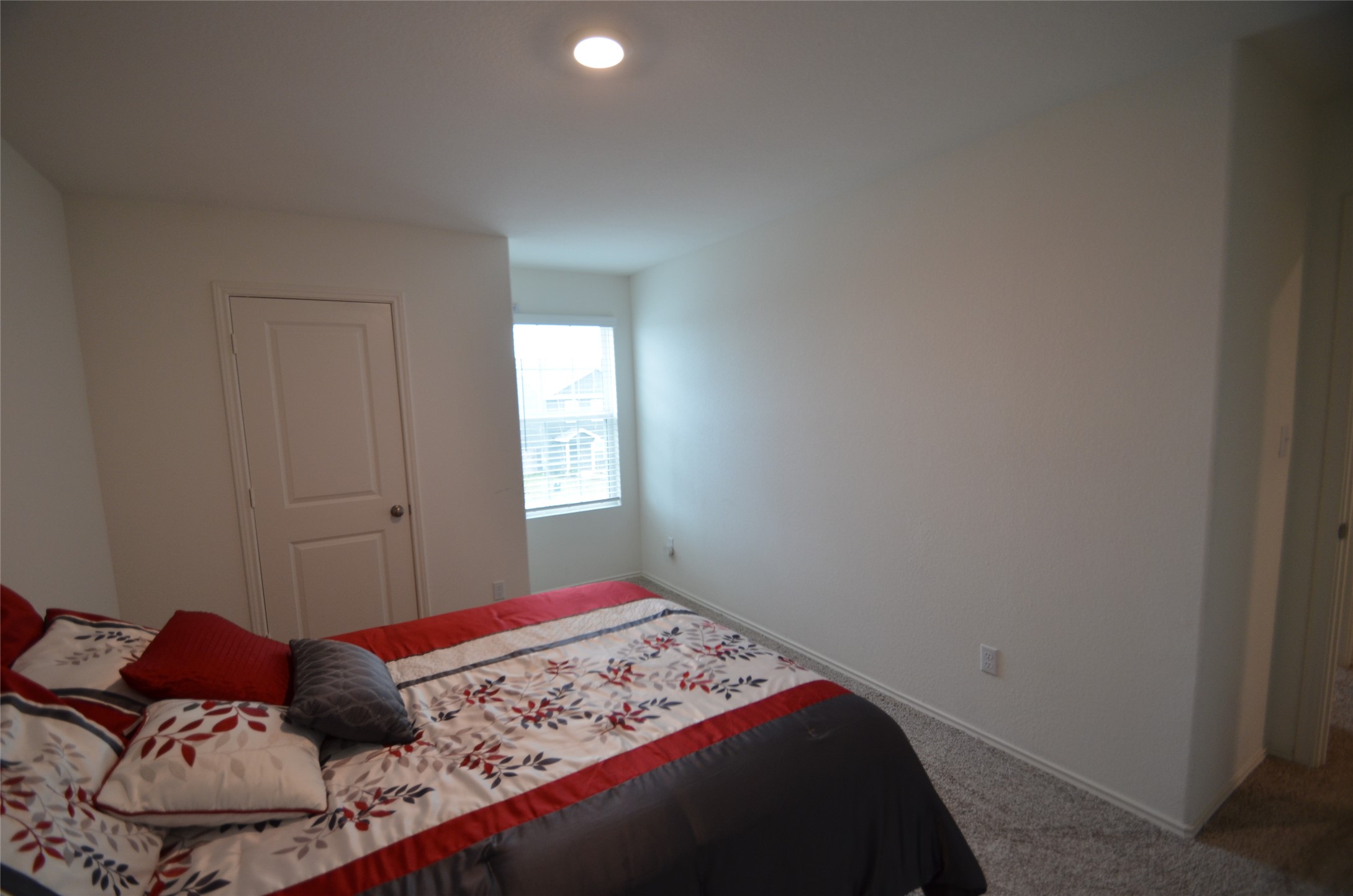 13706 Mussel Run Elgin, TX 78621 - Photo 21 of 34 a bedroom with a bed and a window