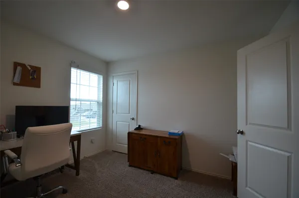 a room with furniture and a window