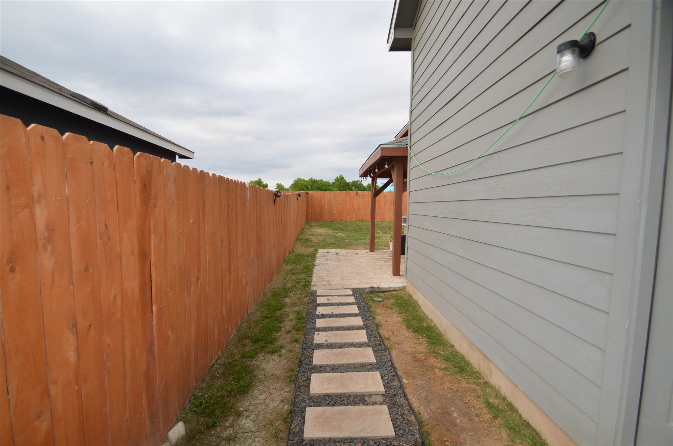 13706 Mussel Run Elgin, TX 78621 - Photo 29 of 34 a view of a pathway with a backyard