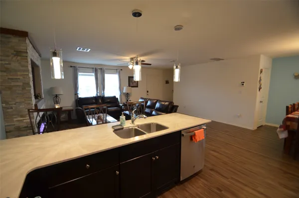 a kitchen with a sink and cabinets