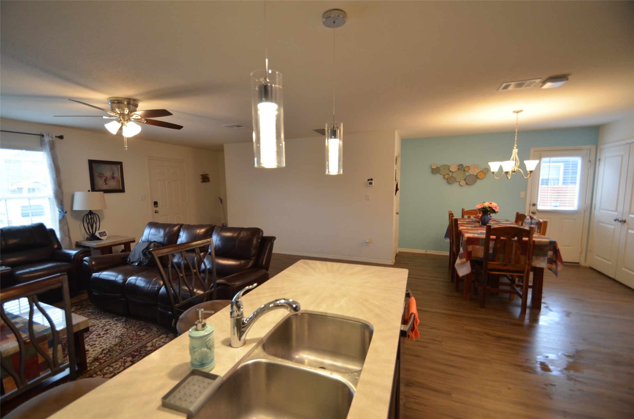 13706 Mussel Run Elgin, TX 78621 - Photo 6 of 34 a living room with furniture a fireplace and wooden floor