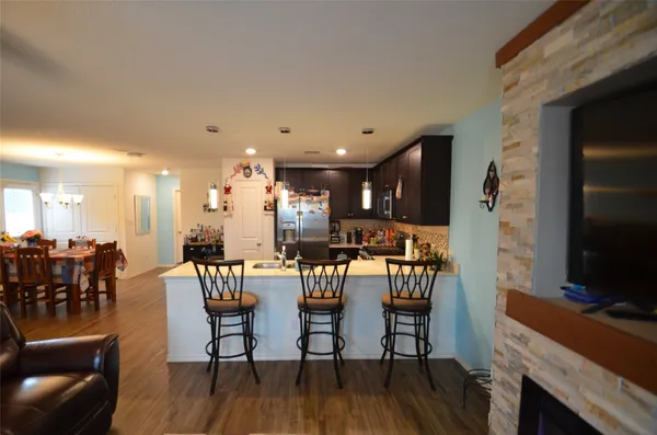 a view of a dining room with furniture and wooden floor