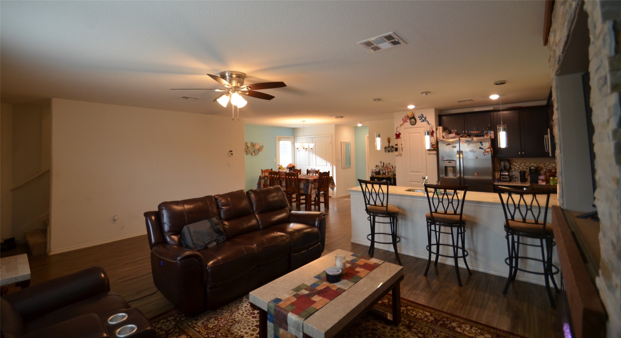 13706 Mussel Run Elgin, TX 78621 - Photo 10 of 34 a living room with furniture a ceiling fan and a rug