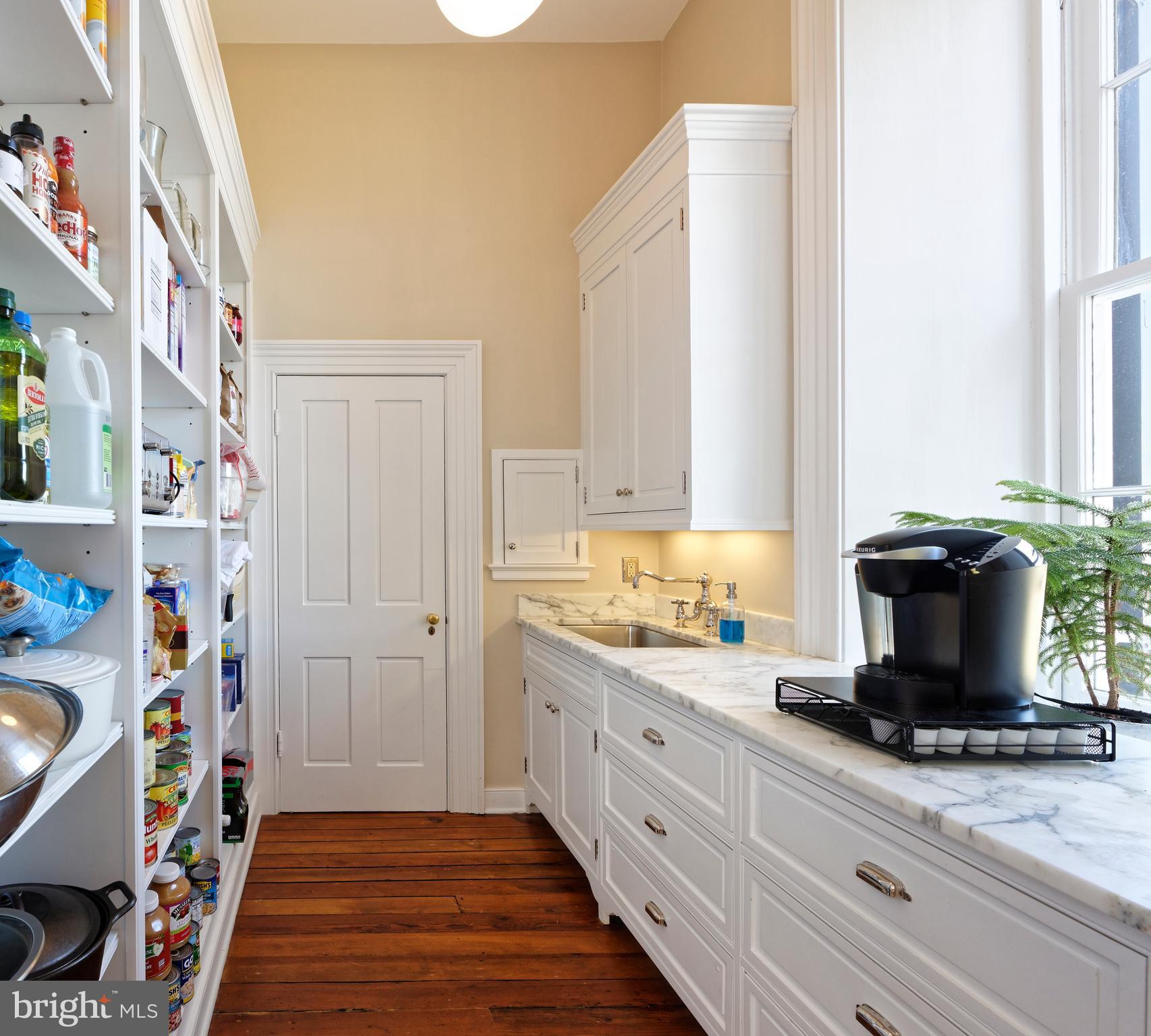 7064 Young Road The Plains, VA 20198 - Photo 13 of 89 a kitchen with a sink and wooden floor
