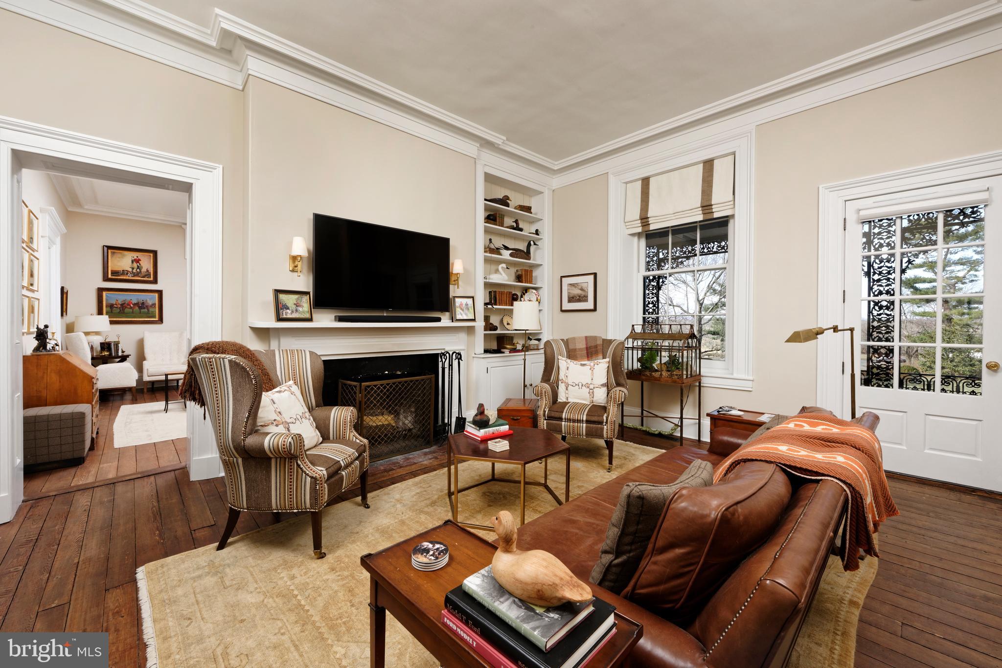 7064 Young Road The Plains, VA 20198 - Photo 14 of 89 a living room with furniture a flat screen tv and a fireplace