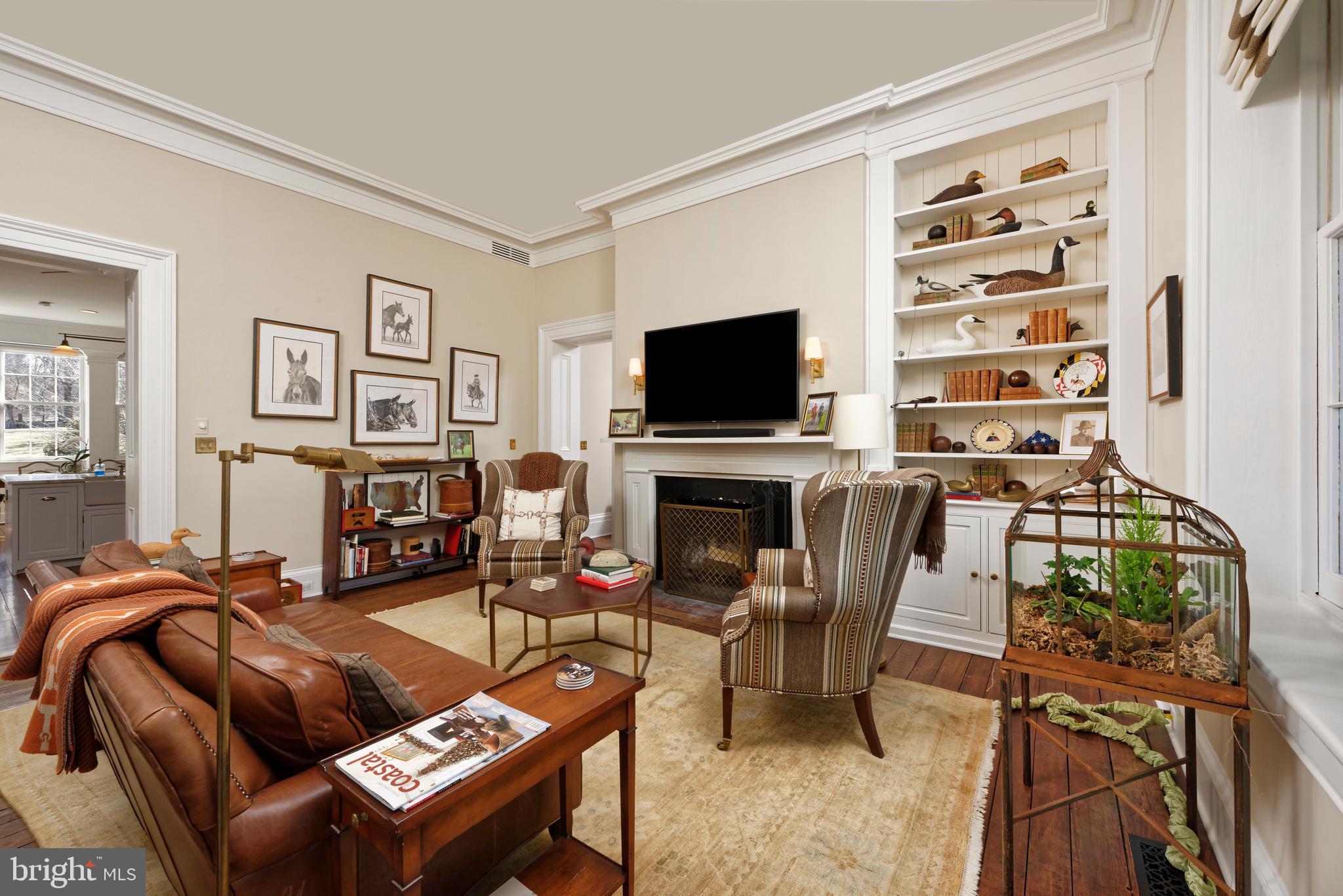 7064 Young Road The Plains, VA 20198 - Photo 16 of 89 a living room with furniture a flat screen tv and a fireplace