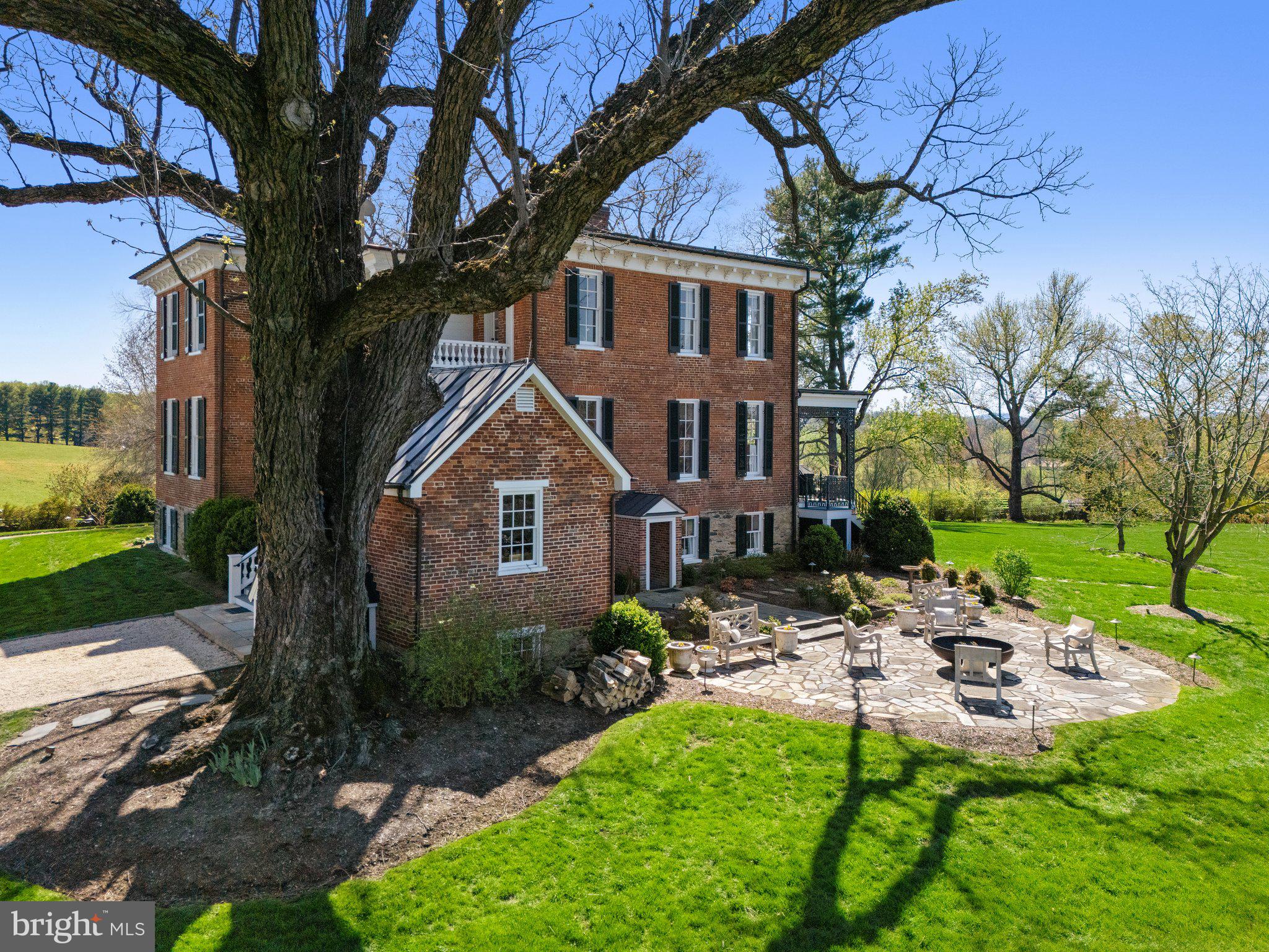7064 Young Road The Plains, VA 20198 - Photo 45 of 89 a front view of a house with garden and trees