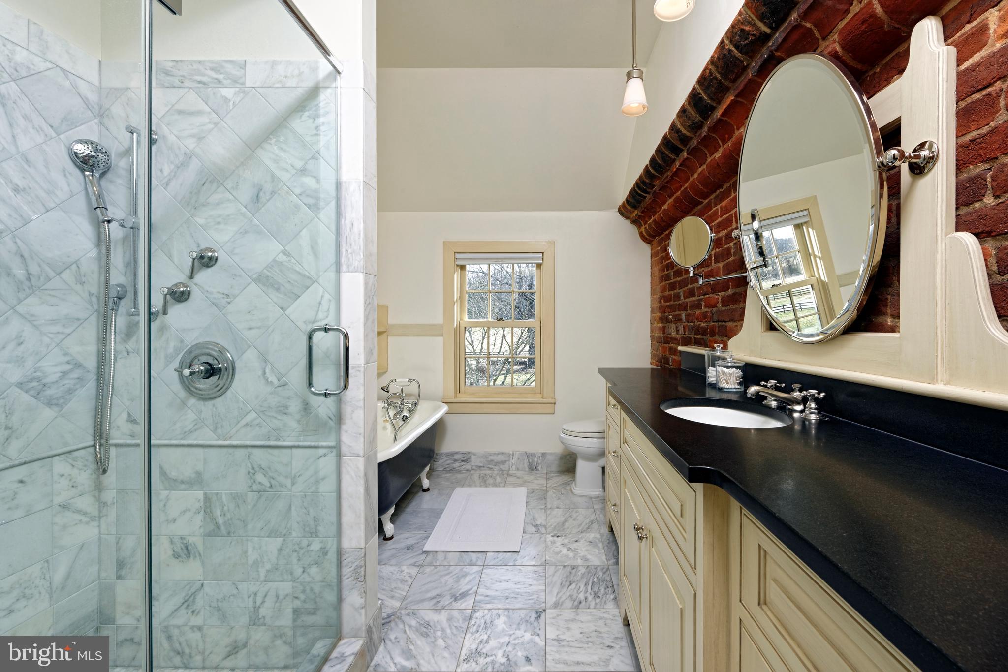 7064 Young Road The Plains, VA 20198 - Photo 61 of 89 a bathroom with a double vanity sink a and a mirror
