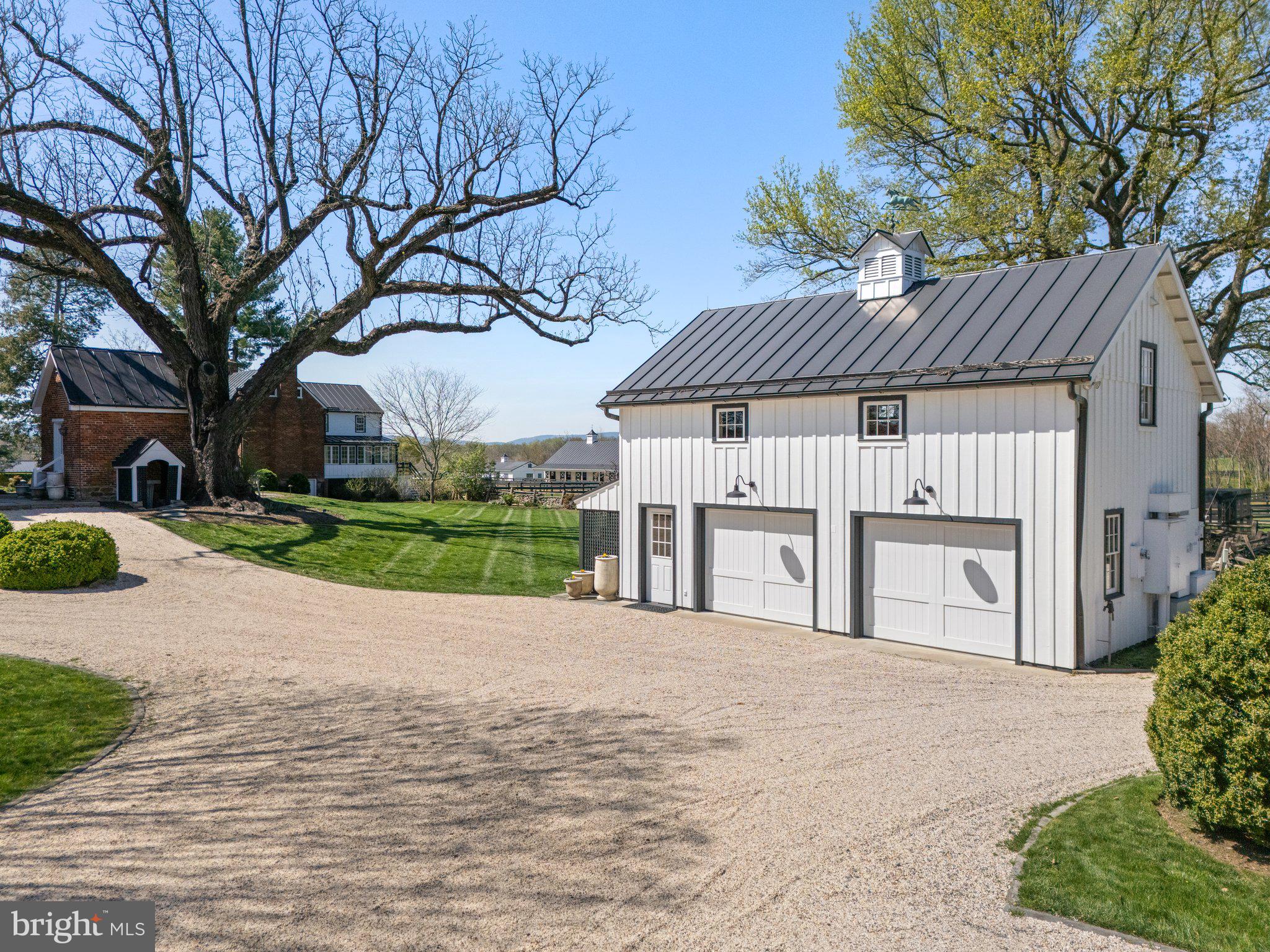 7064 Young Road The Plains, VA 20198 - Photo 64 of 89 a front view of a house with a garden and yard
