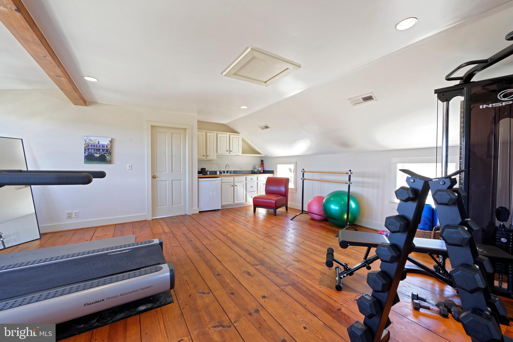 7064 Young Road The Plains, VA 20198 - Photo 66 of 89 a room with gym equipment and wooden floor