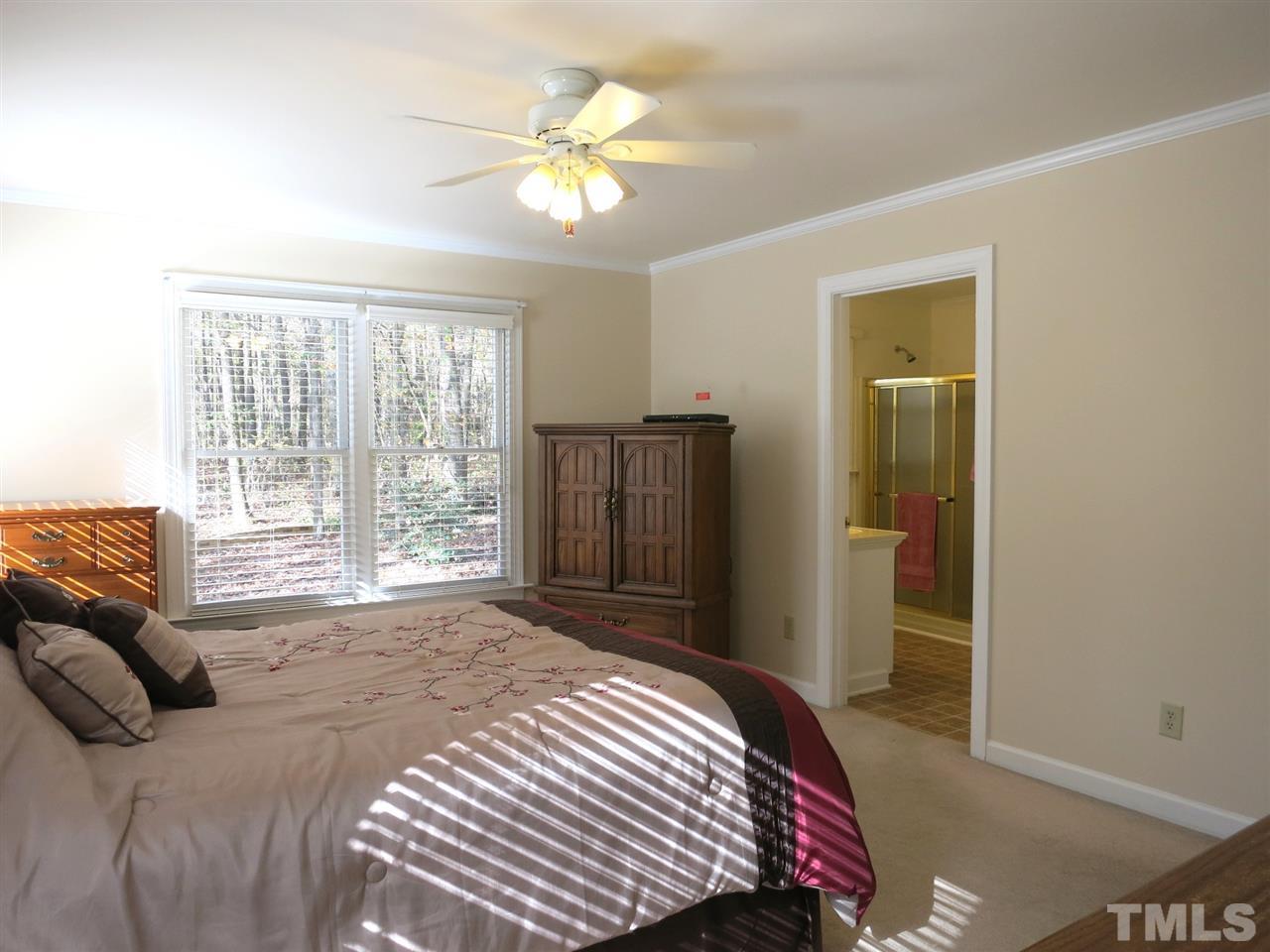 4300 Quarry Road Zebulon, NC 27597 - Photo 14 of 25 a bedroom with a bed and wooden floor