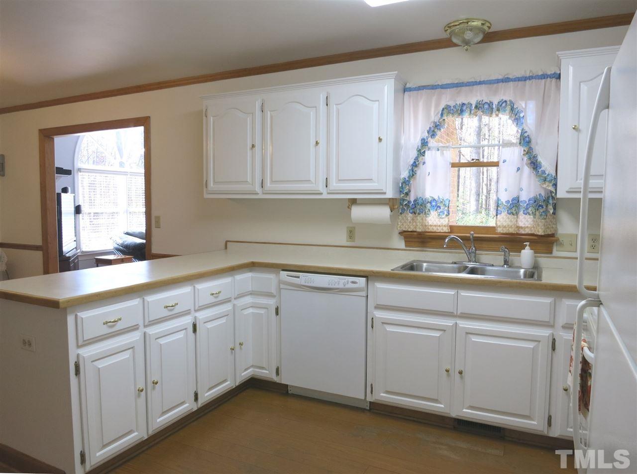 4300 Quarry Road Zebulon, NC 27597 - Photo 9 of 25 a kitchen with sink cabinets and window