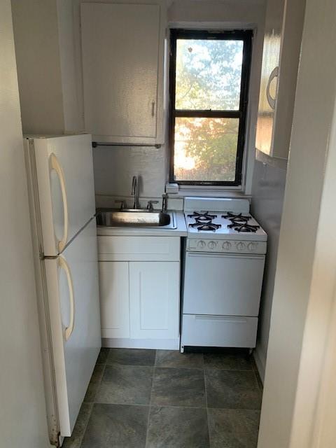 20 89th Street, Unit 3A Brooklyn, NY 11209 - Photo 14 of 18 a utility room with washer and dryer
