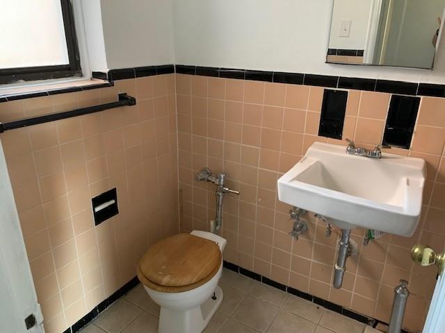 20 89th Street, Unit 3A Brooklyn, NY 11209 - Photo 7 of 18 a bathroom with a sink toilet and shower
