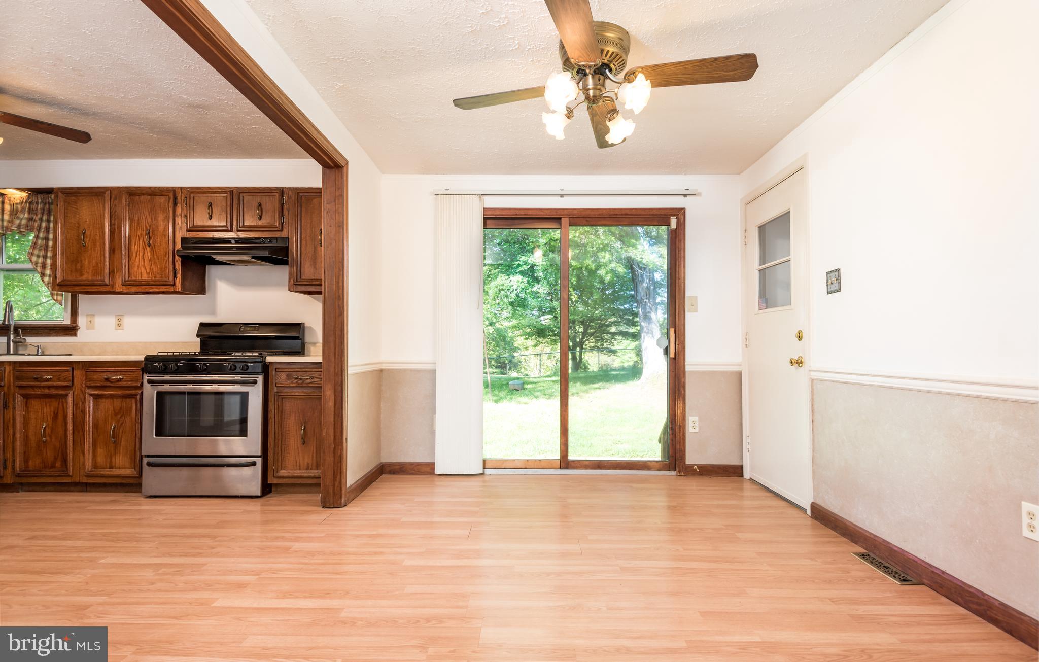 9554 Meetze Road Midland, VA 22728 - Photo 10 of 39 Lightfilled dining area overlooks lge fenced yard