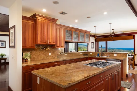 a kitchen with a stove a sink and a refrigerator