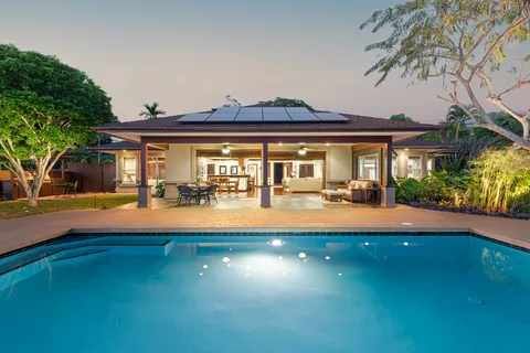 a view of swimming pool with outdoor seating and a yard