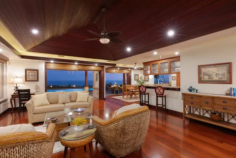 a living room with lots of furniture and wooden floors