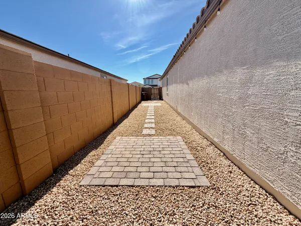 a view of wooden floor with a white wall