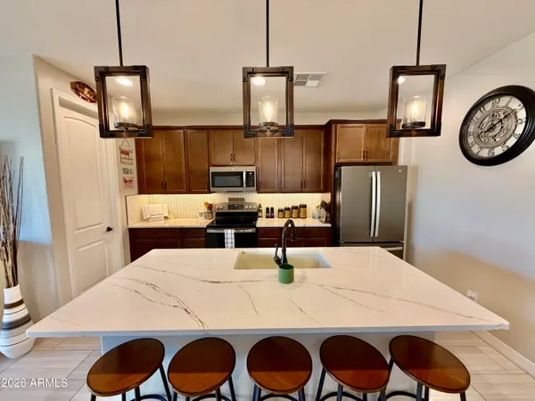 a dining table with chairs and wooden floor