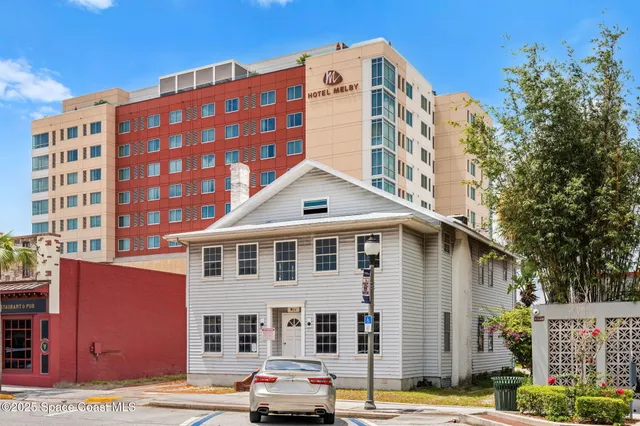 a front view of a building with street view